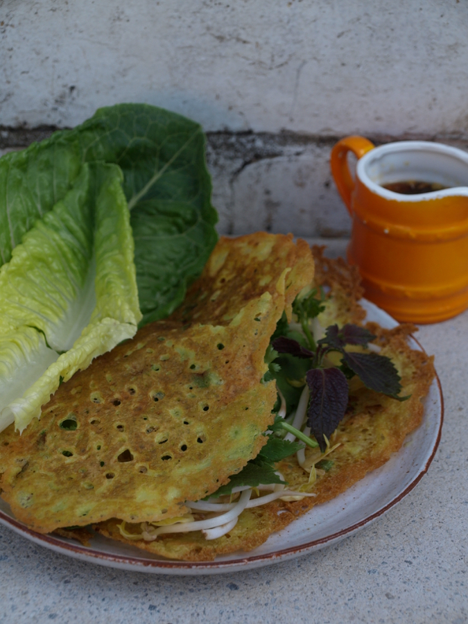 Vietnamese pancakes with bean sprouts, herbs and lettuce
